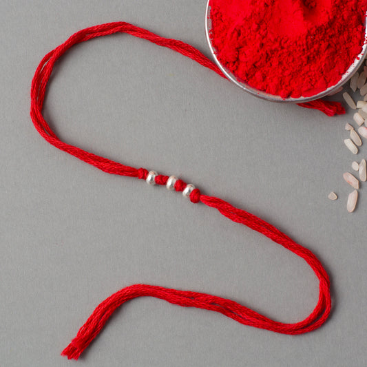 Simple Bead Rakhi with Red Thread